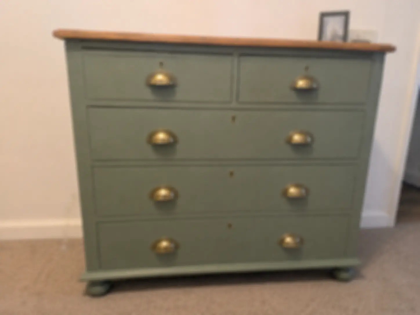 Unclear blurry photo of a chest of drawers