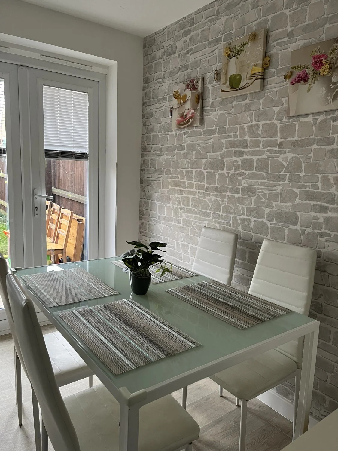 Modern Glass-Top Dining Table with White Chairs