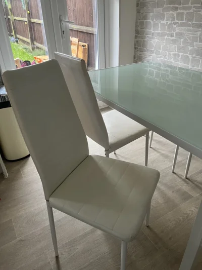 Modern Glass-Top Dining Table with White Chairs — image 10