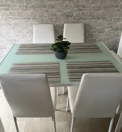 Modern Glass-Top Dining Table with White Chairs — image 4