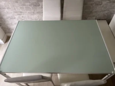 Modern Glass-Top Dining Table with White Chairs — image 7