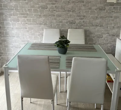 Modern Glass-Top Dining Table with White Chairs — image 3