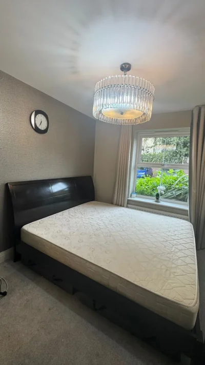 King-size bed with mattress and two side tables — image 4