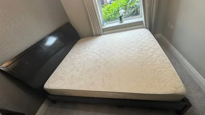 King-size bed with mattress and two side tables