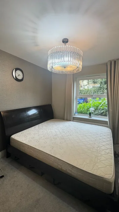 King-size bed with mattress and two side tables — image 5