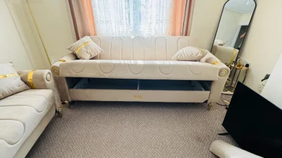 Modern 3-seater sofabed in beige with gold accents — image 3