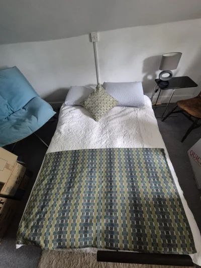 Blue futon sofabed with cushions — image 2