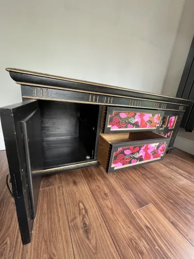 Vintage black storage cabinet with decorative panels — image 10