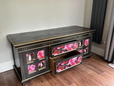 Vintage black storage cabinet with decorative panels — image 4