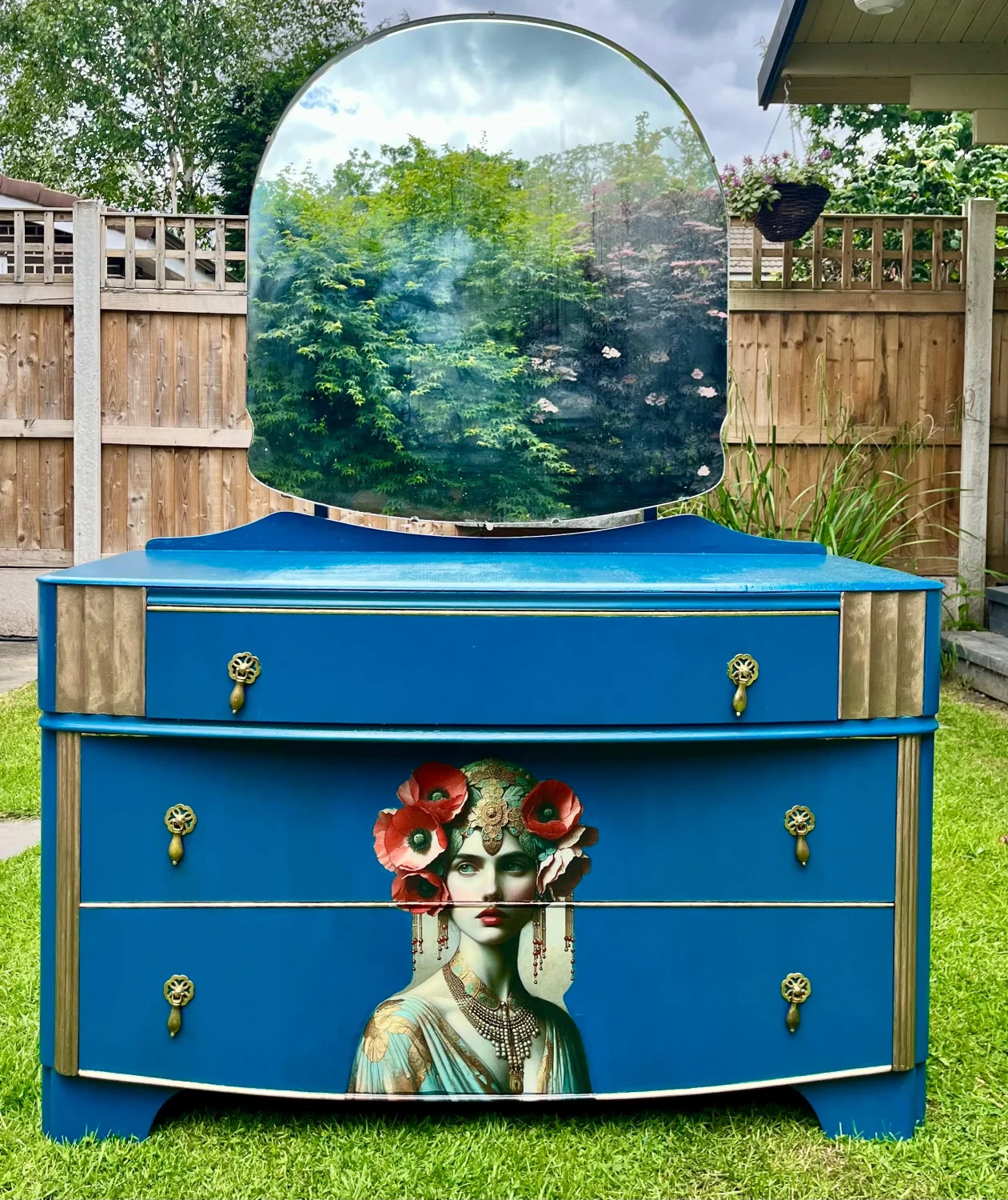 Vintage blue dresser with mirror and decorative details