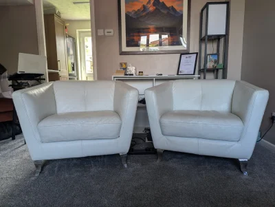 Pair of modern white leather armchairs with chrome legs on Furnish Well