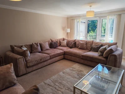 Large modern corner sofa in soft beige upholstery — image 4