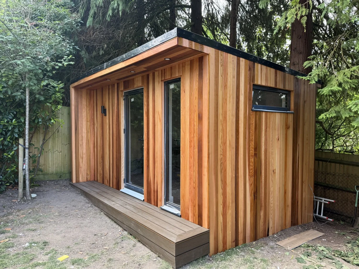 Modern garden office with wood cladding and large windows