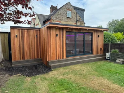 Modern garden office with wood cladding and large windows — image 2