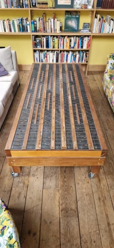 Unique coffee table constructed from 19th century organ soundboard — image 6