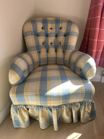 Vintage patterned armchair with tufted back and ruffled skirt on Furnish Well