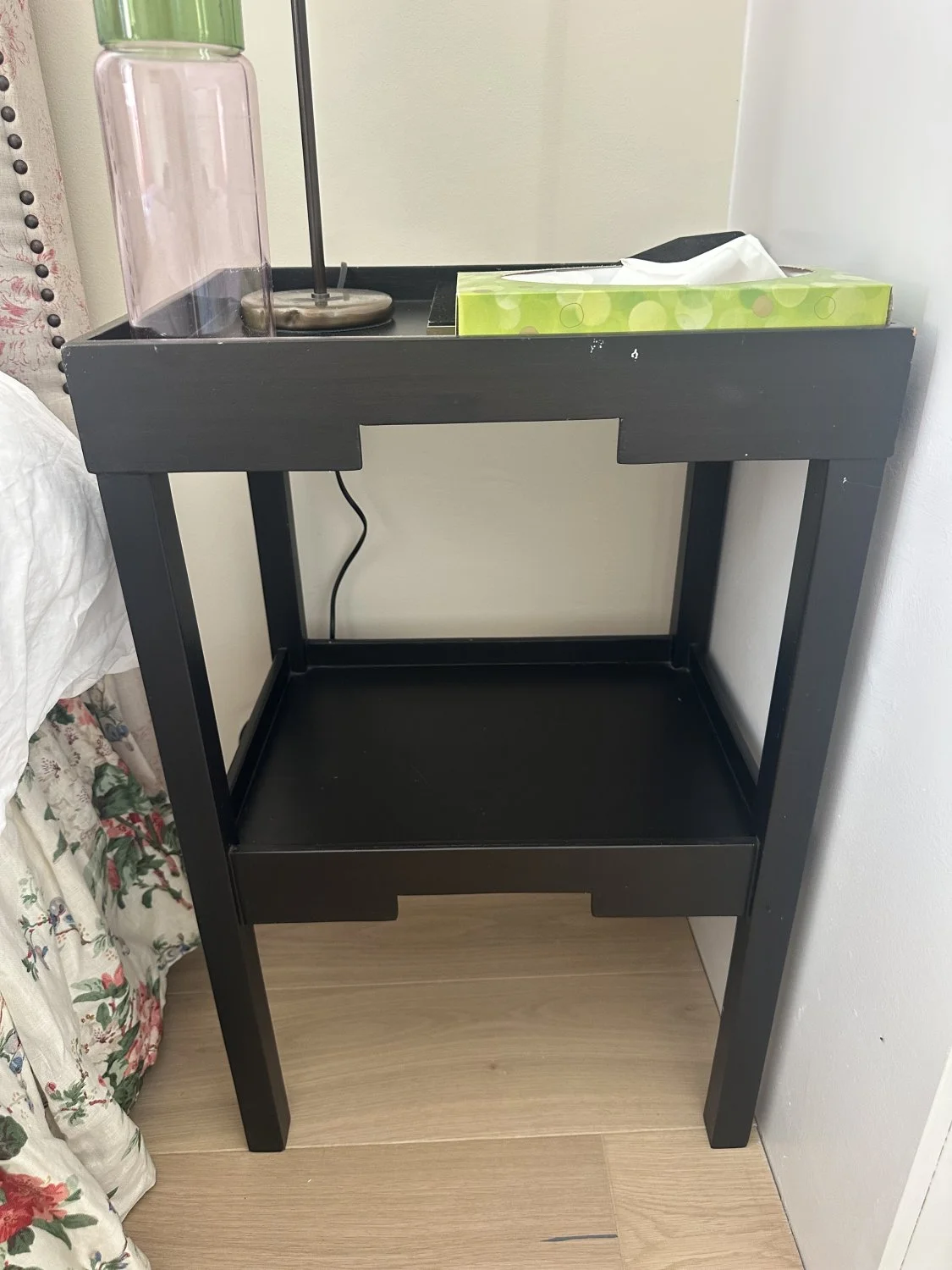 A pair of Modern black side tables with storage shelf