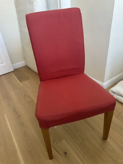Modern red upholstered dining chair with wooden legs