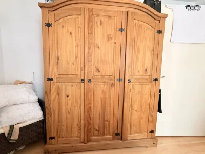 Matching pine triple wardrobe and five-drawer chest of drawers set on Furnish Well