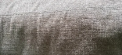 Modern two-seater sofa in warm taupe woven fabric with scatter cushions — image 3