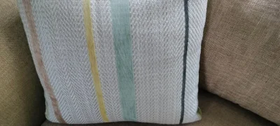 Modern two-seater sofa in warm taupe woven fabric with scatter cushions — image 4