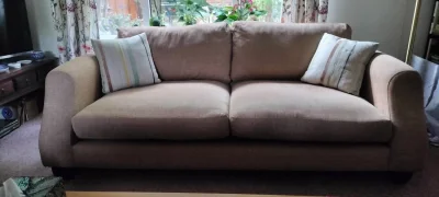 Modern two-seater sofa in warm taupe woven fabric with scatter cushions on Furnish Well