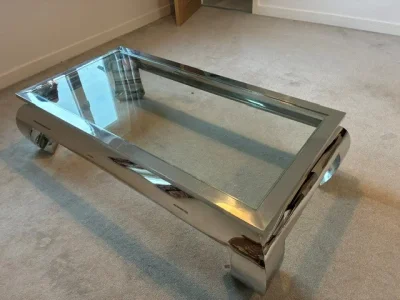 Large rectangular glass coffee table with polished metal frame on Furnish Well