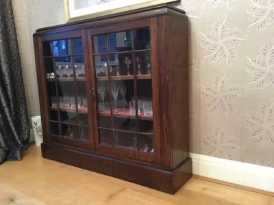 Vintage dark wood glazed display cabinet with leaded-style doors on Furnish Well