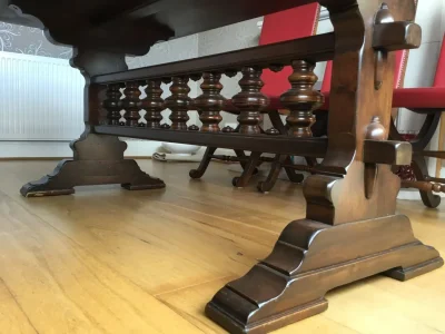Vintage dark wood trestle dining table with 6 red leather backed chairs — image 2