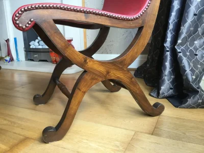 Vintage dark wood trestle dining table with 6 red leather backed chairs — image 5