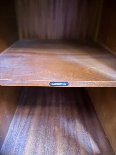 Vintage dark wood wardrobe with carved doors, hanging rail and shelves — image 7