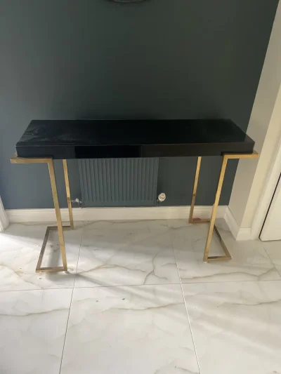 Modern black gloss console table with gold-tone metal frame on Furnish Well