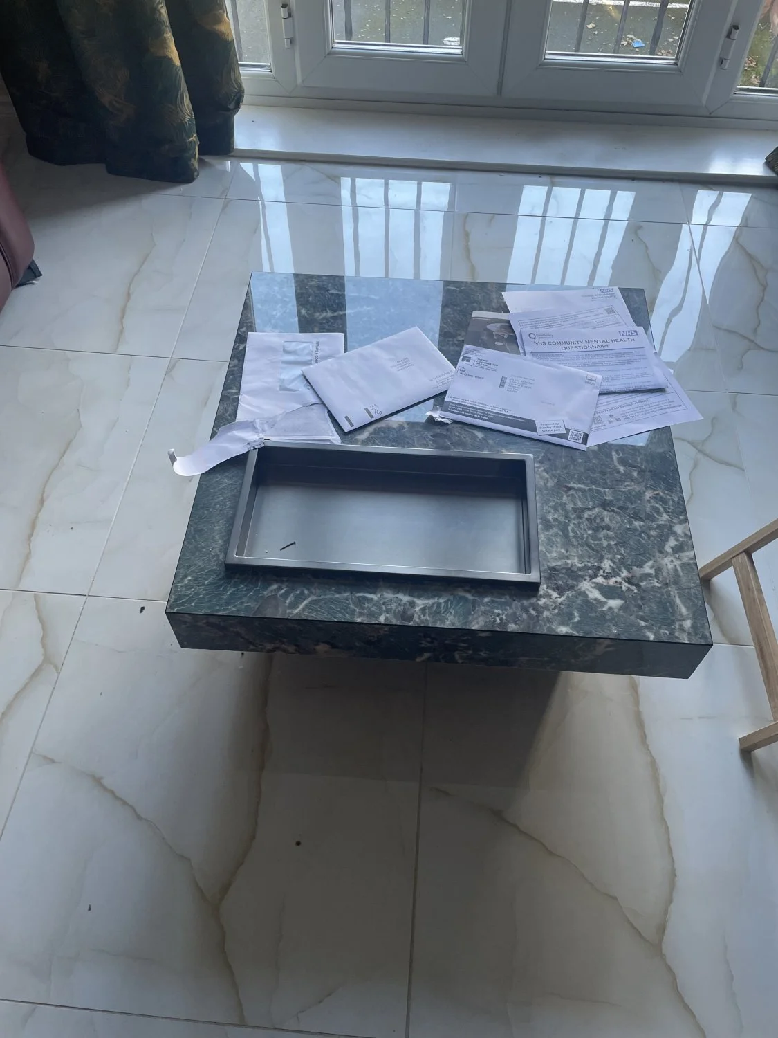 Modern dark marble-look coffee table with recessed metal tray