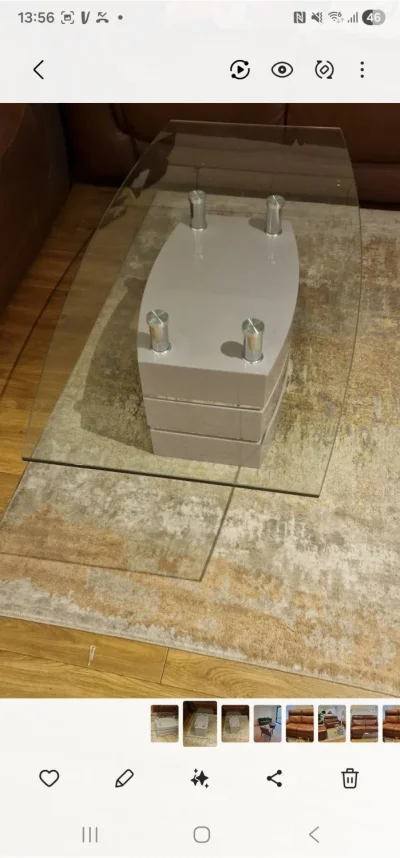 Modern rectangular glass-top coffee table with layered grey base