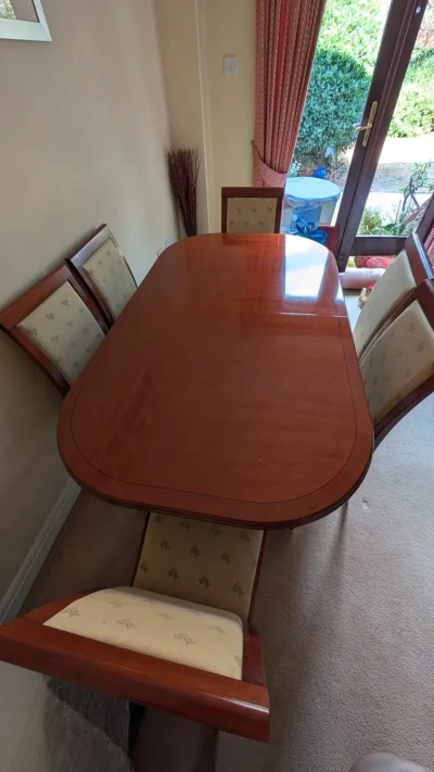 Vintage Extendable Mahogany-Tone Dining Table with Six Upholstered Chairs on Furnish Well