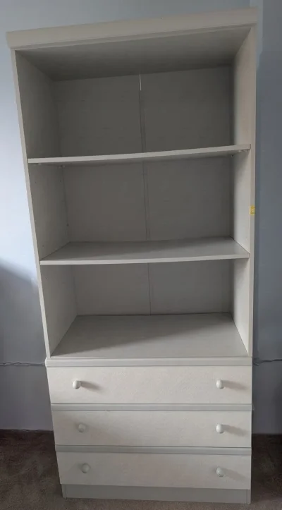 Tall white bookcase with three drawers and open shelving on Furnish Well