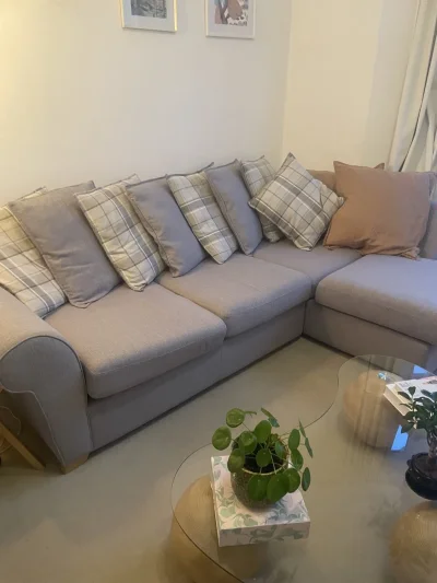 Grey fabric corner sectional sofa with generous left-hand chaise lounge