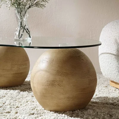 Daals Modern clear glass coffee table with three wood-effect ball bases — image 6