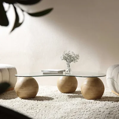 Daals Modern clear glass coffee table with three wood-effect ball bases — image 4
