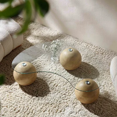 Daals Modern clear glass coffee table with three wood-effect ball bases — image 5