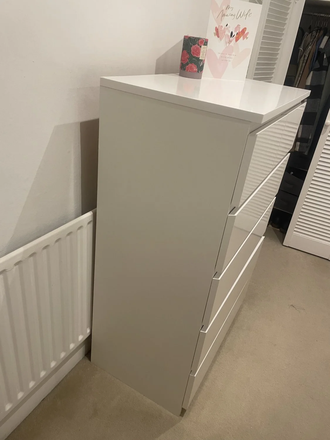 White tall chest of drawers with six handleless drawers