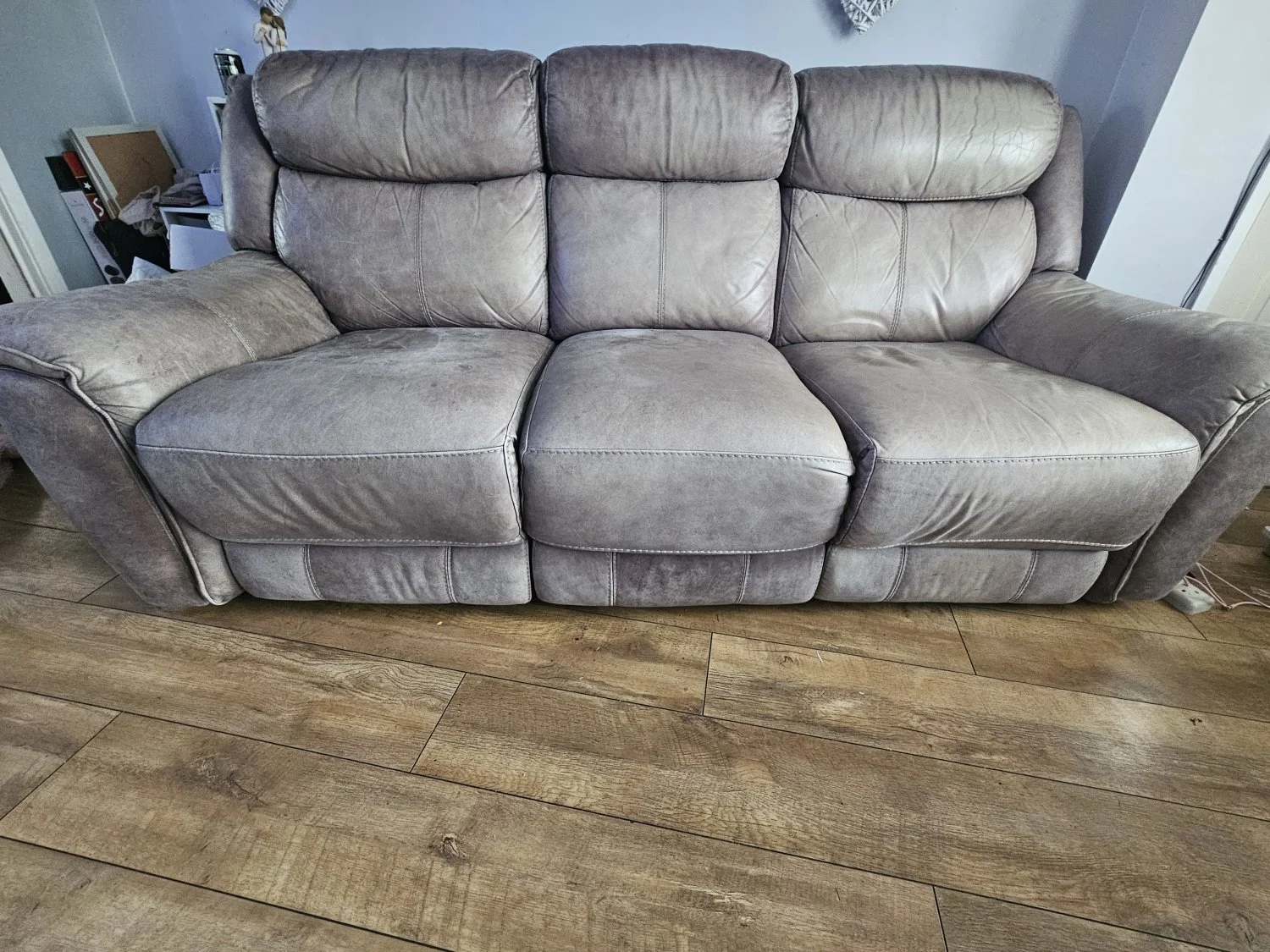 Grey three-seat power reclining sofa with USB charging port