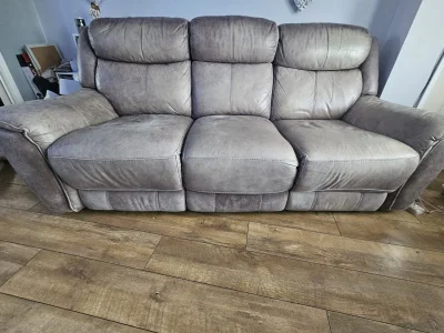 Grey three-seat power reclining sofa with USB charging port