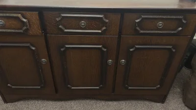 Vintage dark wood three-door sideboard with drawers and shelf storage on Furnish Well