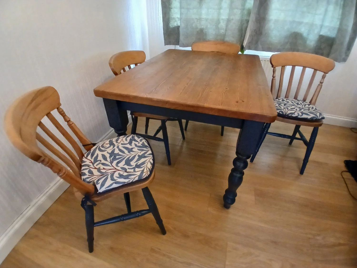 Vintage-style painted dining table and four spindle-back chairs
