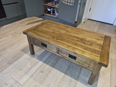Vintage rustic oak coffee table with four drawers and dark metal handles — image 2