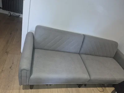 Modern three-seat grey fabric sofa bed with stitched back cushions — image 2