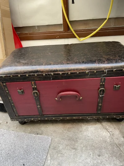 Vintage-style burgundy storage trunk with padded crackle-look lid on Furnish Well