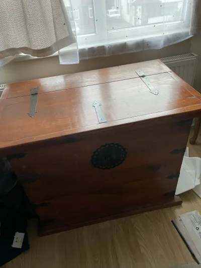 Vintage wooden storage chest with black iron strap hinges and side handle on Furnish Well