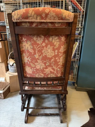 Vintage dark wood upholstered rocking armchair with floral fabric — image 6
